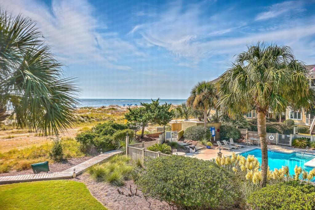 an aerial view of a resort with a swimming pool and the ocean at New Listing! Port O' Call E203-Luxury Ocean View! in Isle of Palms