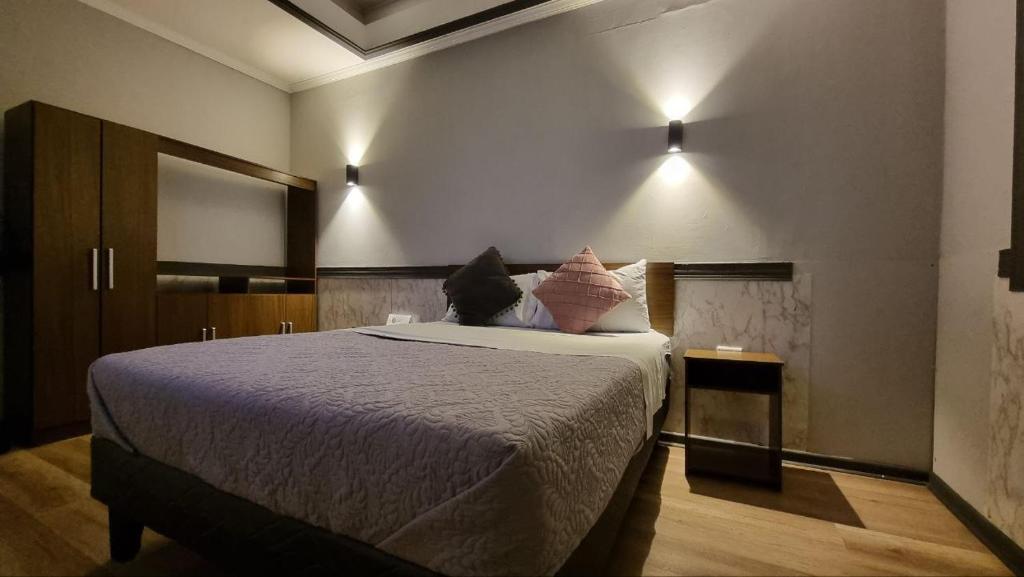 Postel nebo postele na pokoji v ubytování Hotel Asturias