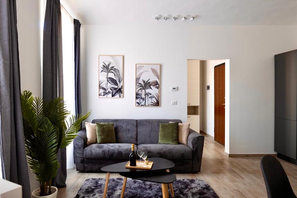 a living room with a couch and a table at Apartment Vitale in Bologna