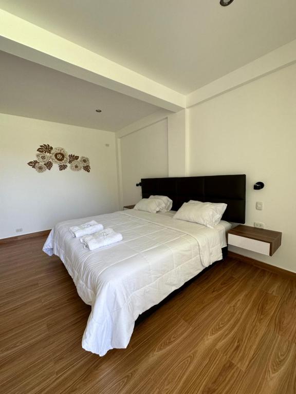 Postel nebo postele na pokoji v ubytování HOTEL & BUNGALOWS VILLA PALMERAS LUNAHUANA