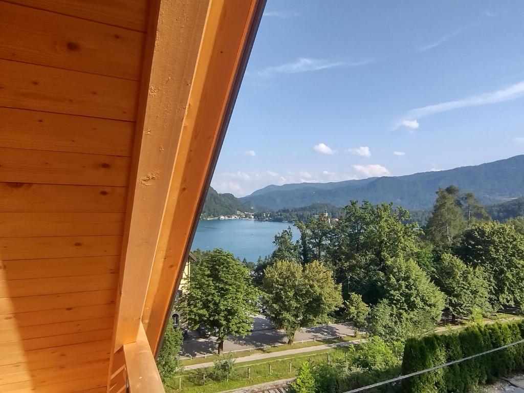 a view of a lake from a cabin at Lakeview Apartments Bled in Bled