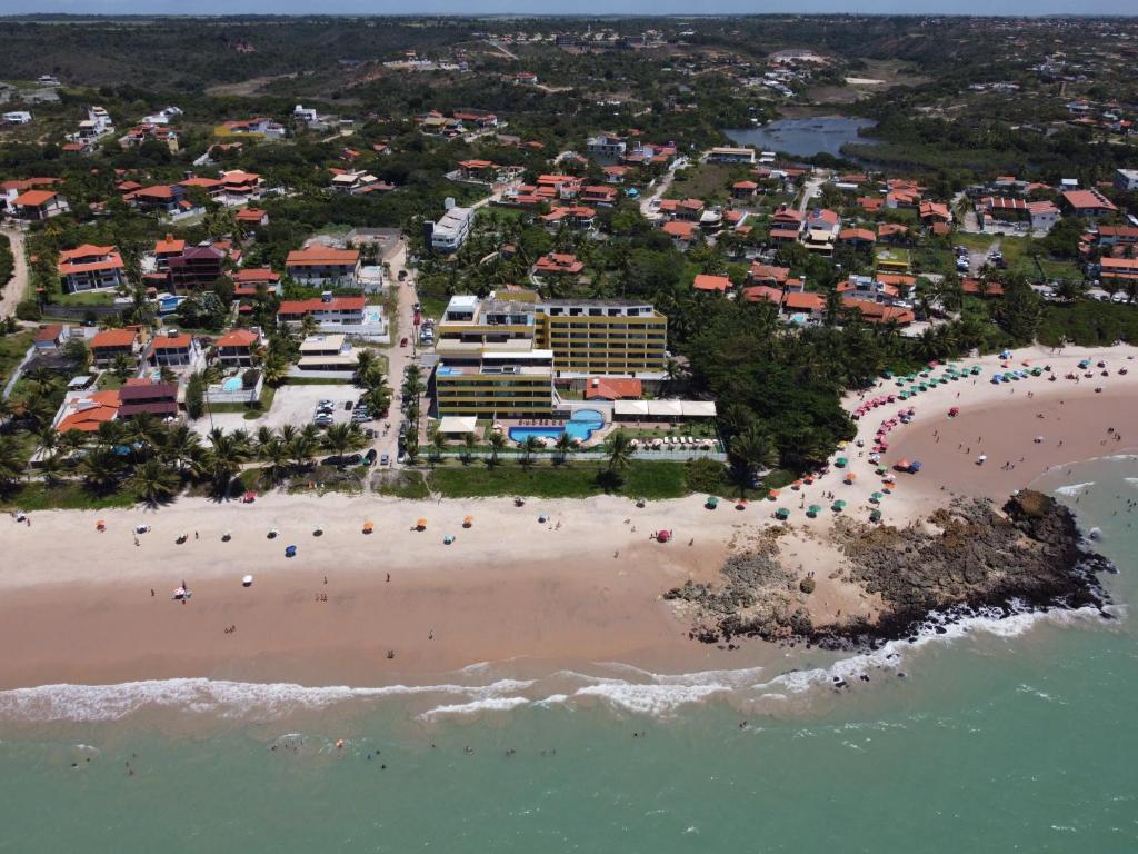 an aerial view of a beach with a resort at Brisas de Tabatinga Flat in Conde