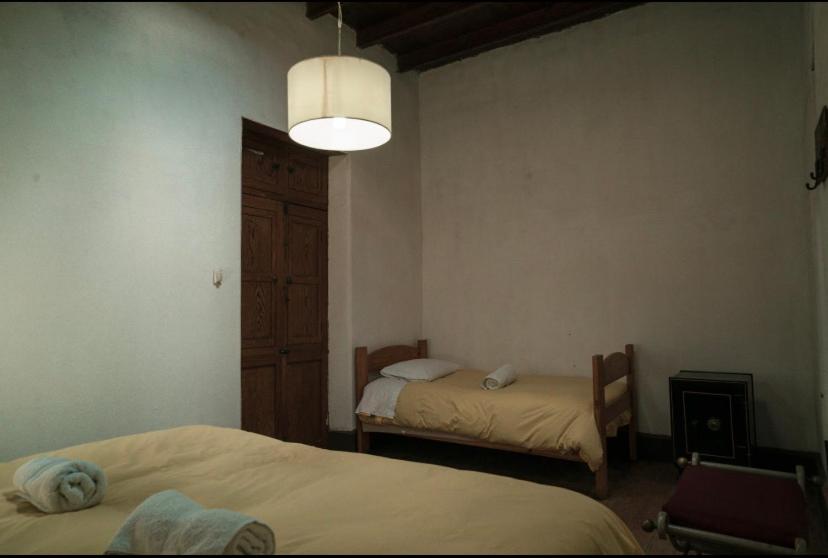 Postel nebo postele na pokoji v ubytování Refugio de Santiago Ecolodge
