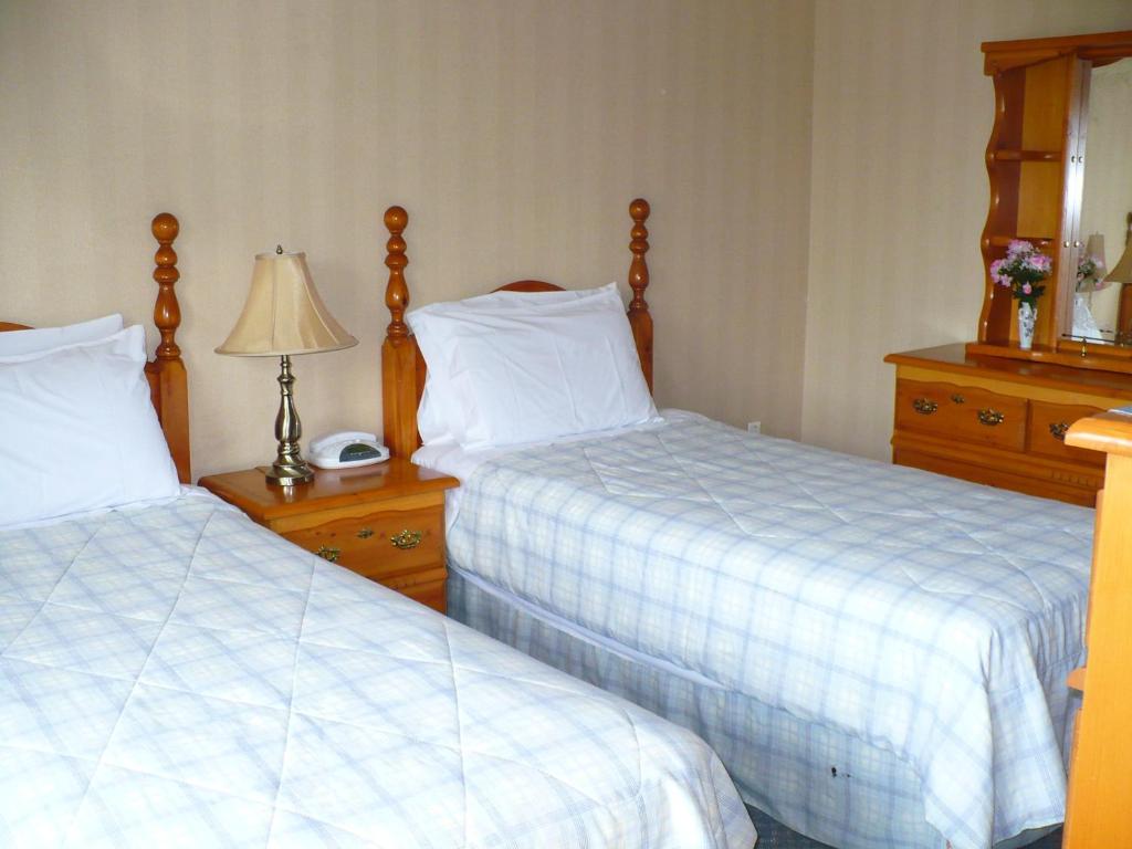 Katil atau katil-katil dalam bilik di Rainbow Bed & Breakfast