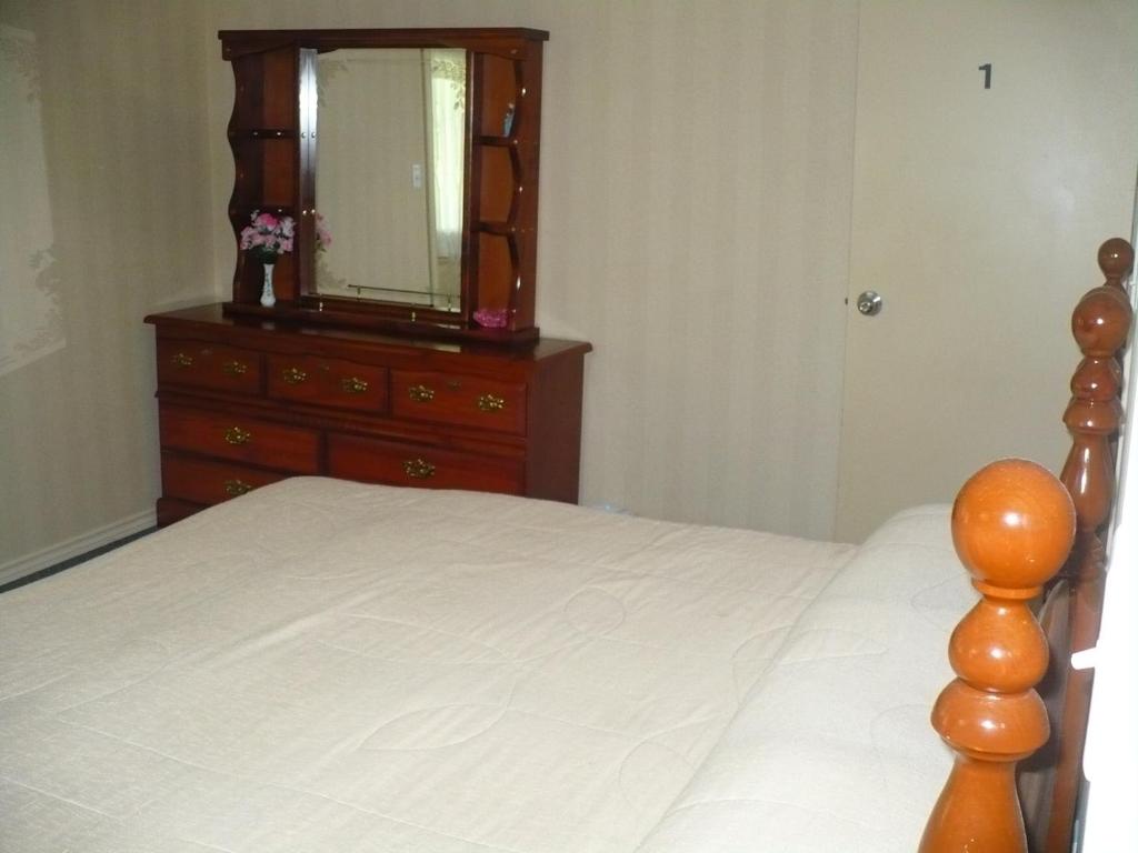 Katil atau katil-katil dalam bilik di Rainbow Bed & Breakfast