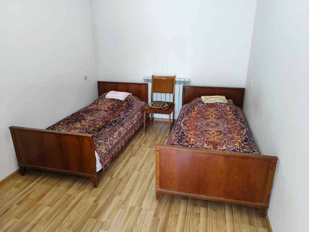 Postel nebo postele na pokoji v ubytování Vanand Guest House
