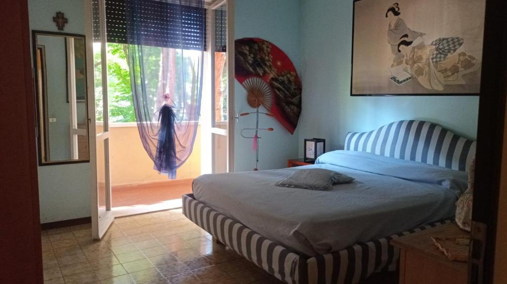 Katil atau katil-katil dalam bilik di Misano Garden Apartment