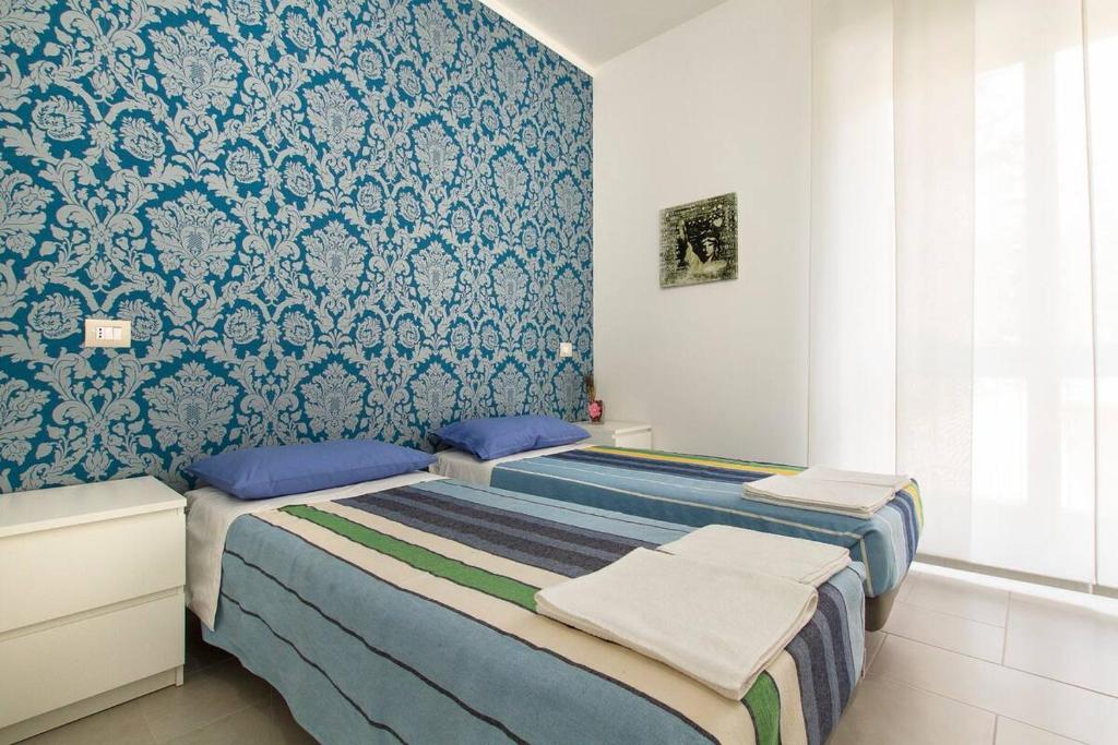 Krevet ili kreveti u jedinici u okviru objekta Apartament Famagosta Milano