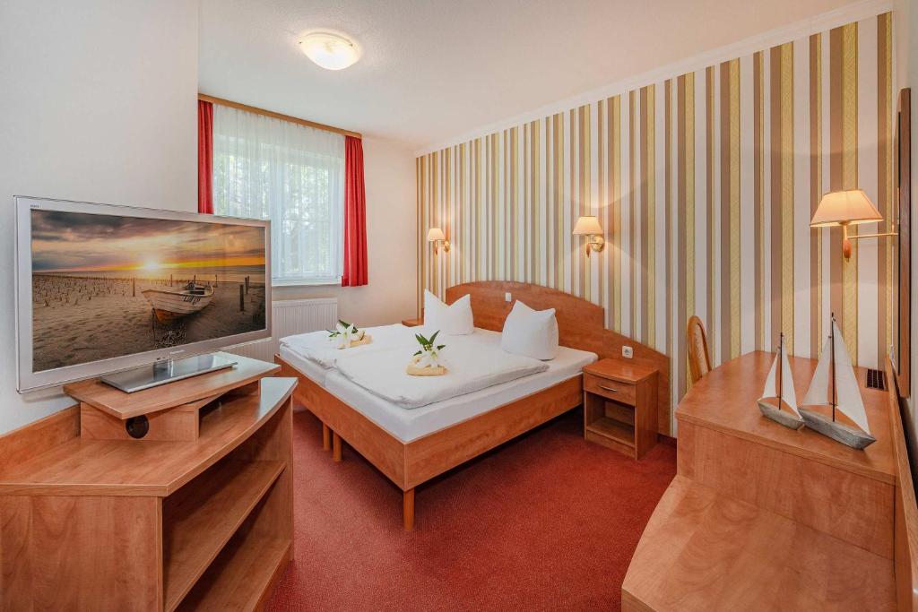 Postel nebo postele na pokoji v ubytování Gasthaus & Pension Natzke