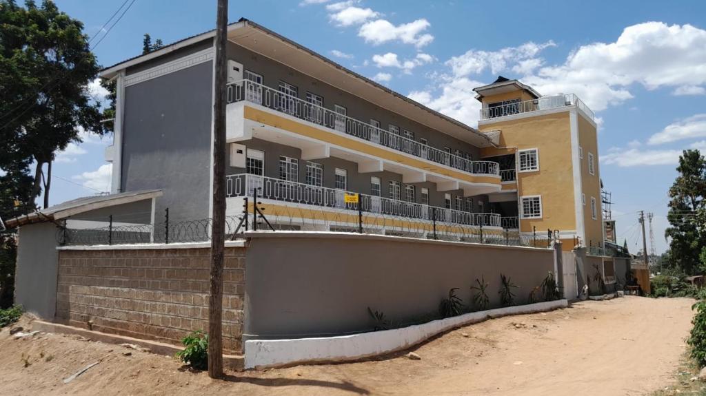 a building with balconies on the side of it at Casa nostra in Kakamega