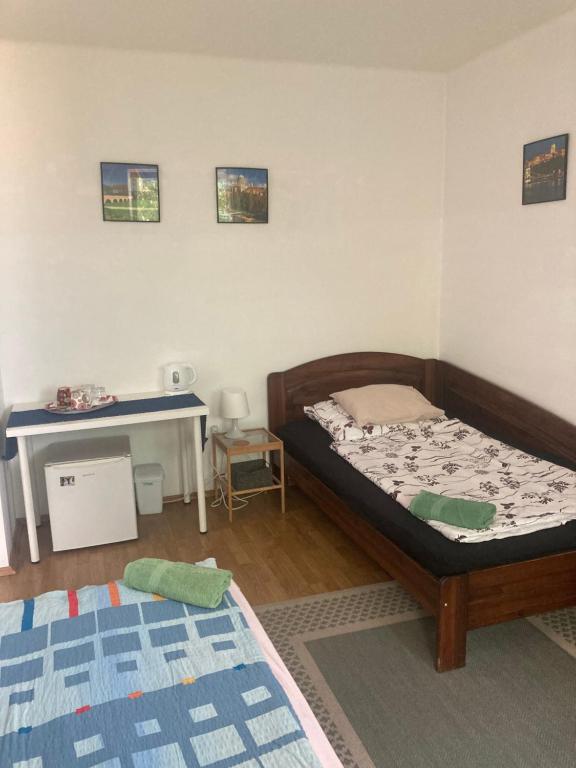 Postel nebo postele na pokoji v ubytování Apartman-Donau Tát