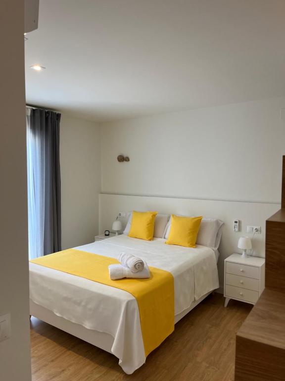 מיטה או מיטות בחדר ב-Casa Torre Hacho