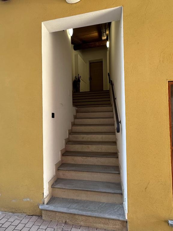 a stairway leading to a building with a stair case at La tana di Piozzo in Piozzo