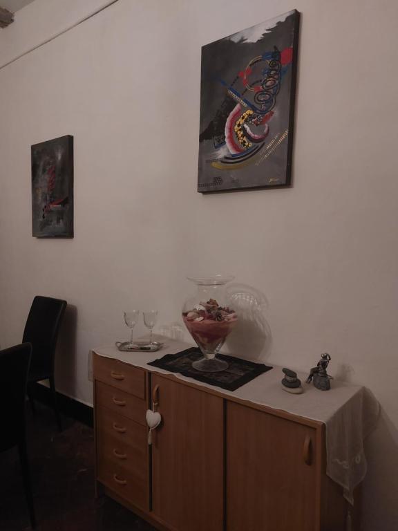 a cabinet with a bowl on top of it at La Quiétude in Cotignac