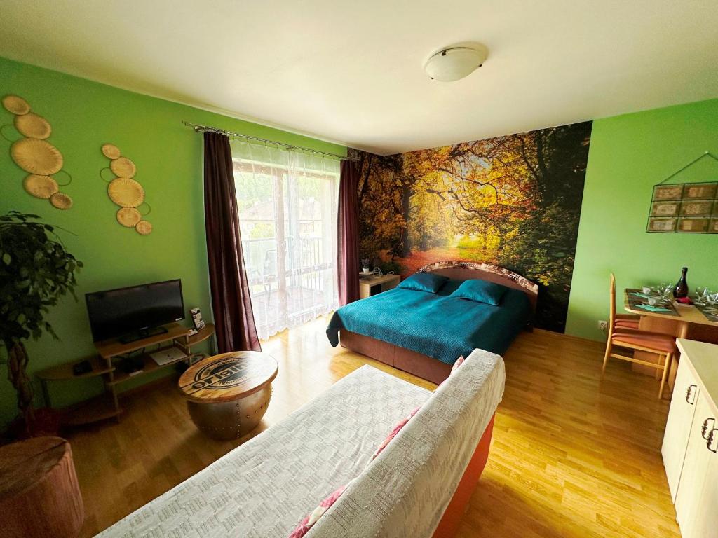 Postel nebo postele na pokoji v ubytování Apartments Liptov City