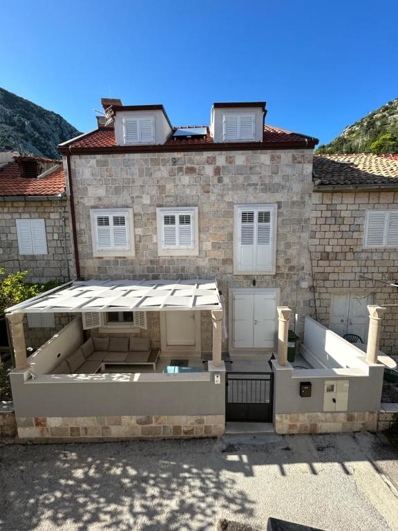 a house with an awning in front of it at @trstenik in Trstenik