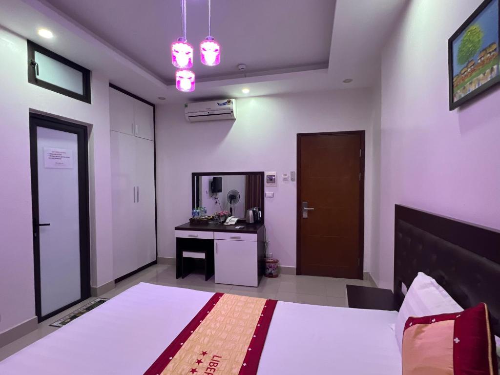 Postel nebo postele na pokoji v ubytování Hotel Liberty Violet