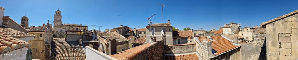 an aerial view of a city with roofs at The Rooftop Arles - Terrasse panoramique in Arles