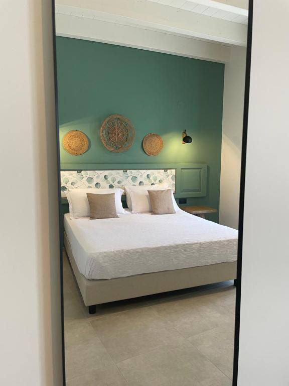 Postel nebo postele na pokoji v ubytování Palazzo Matà Boutique Hotel