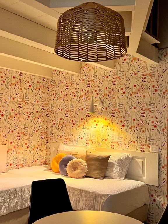 Postel nebo postele na pokoji v ubytování Palazzo Matà Boutique Hotel