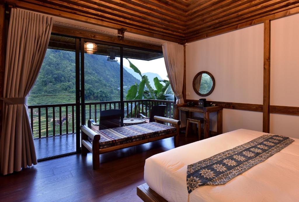 Giường trong phòng chung tại Maison de Lao Chai