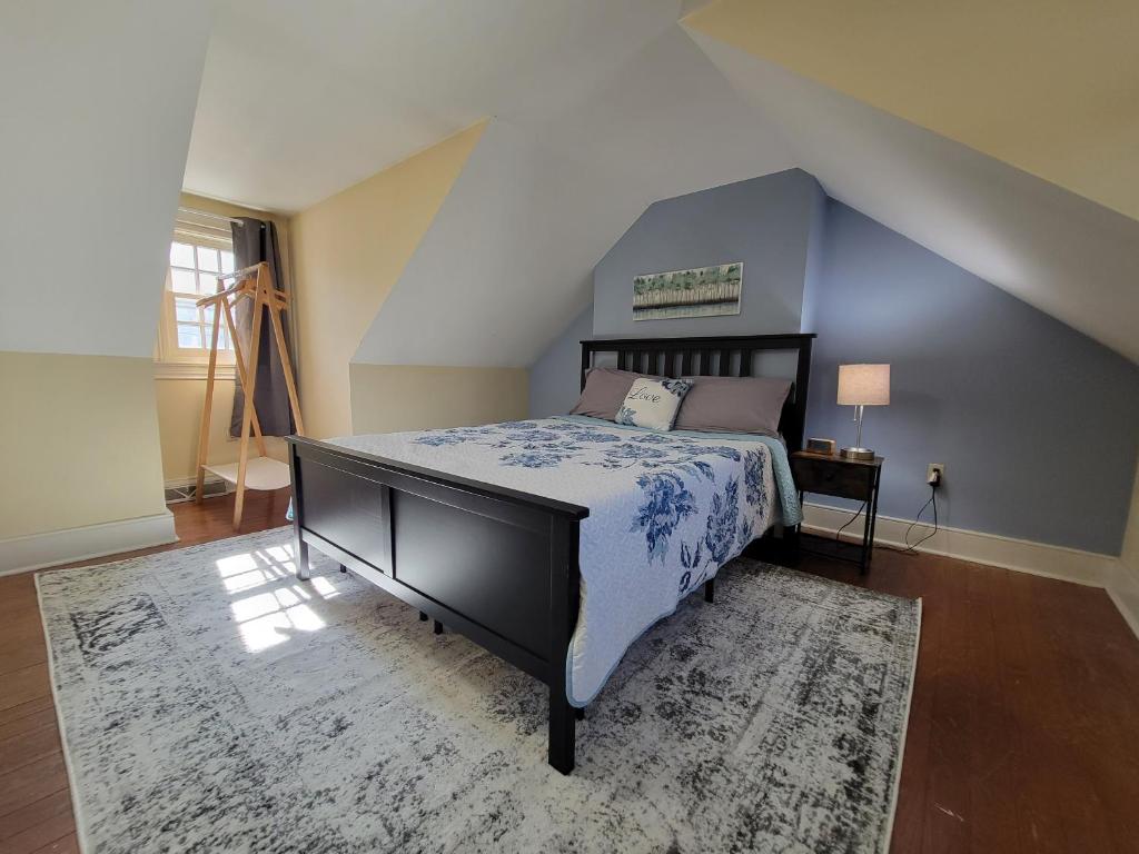 a bedroom with a king sized bed in a attic at The Grand BnB in Harrisburg