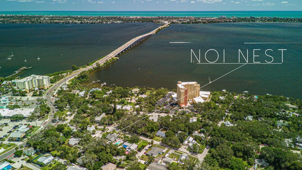 an aerial view of a beach with the words no nest at Noi Nest Home + Pool + Suites in Melbourne