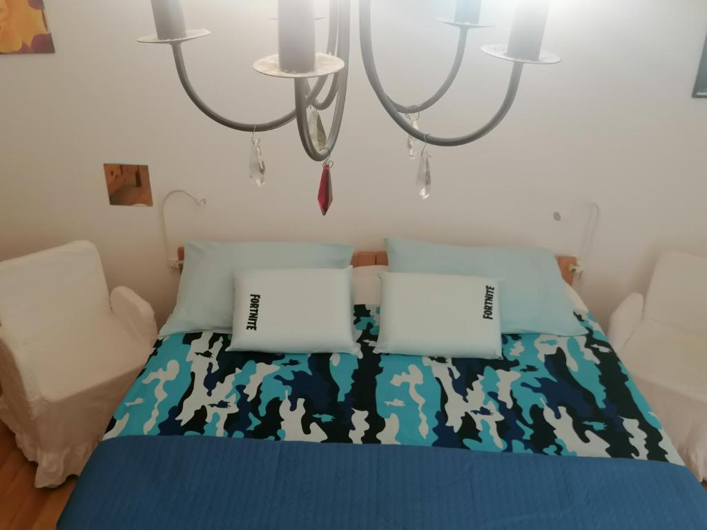 a bedroom with a blue bed with two laptops on it at Big Apartman for1 or2or3or4 in Split