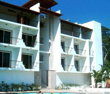 a large white building with balconies on the side of it at HOTEL PARAISO ESCONDIDO in Chacala