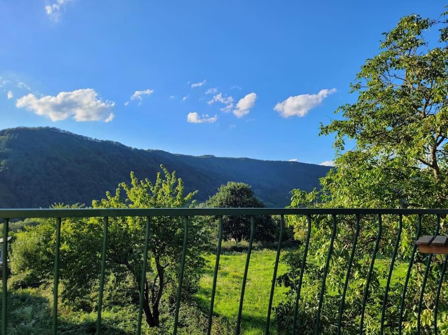 a view of the mountains from a balcony at Willi's Moselschlösschen in Neumagen-Dhron
