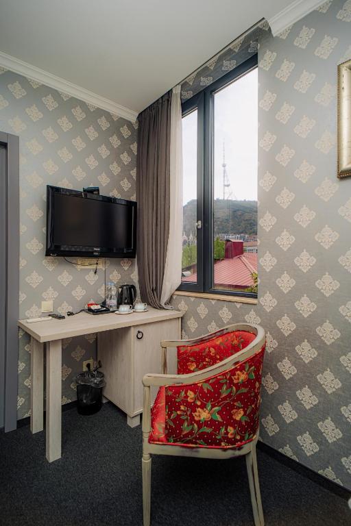 TV a/nebo společenská místnost v ubytování Hotel Day Inn