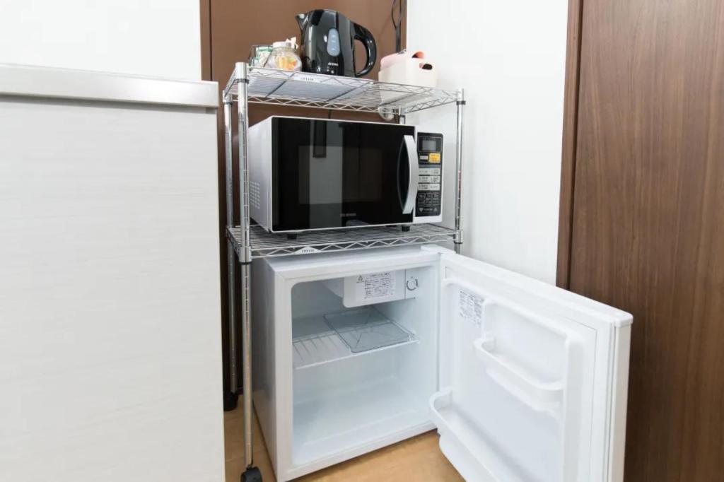 Kuchyň nebo kuchyňský kout v ubytování Hotel Lucky