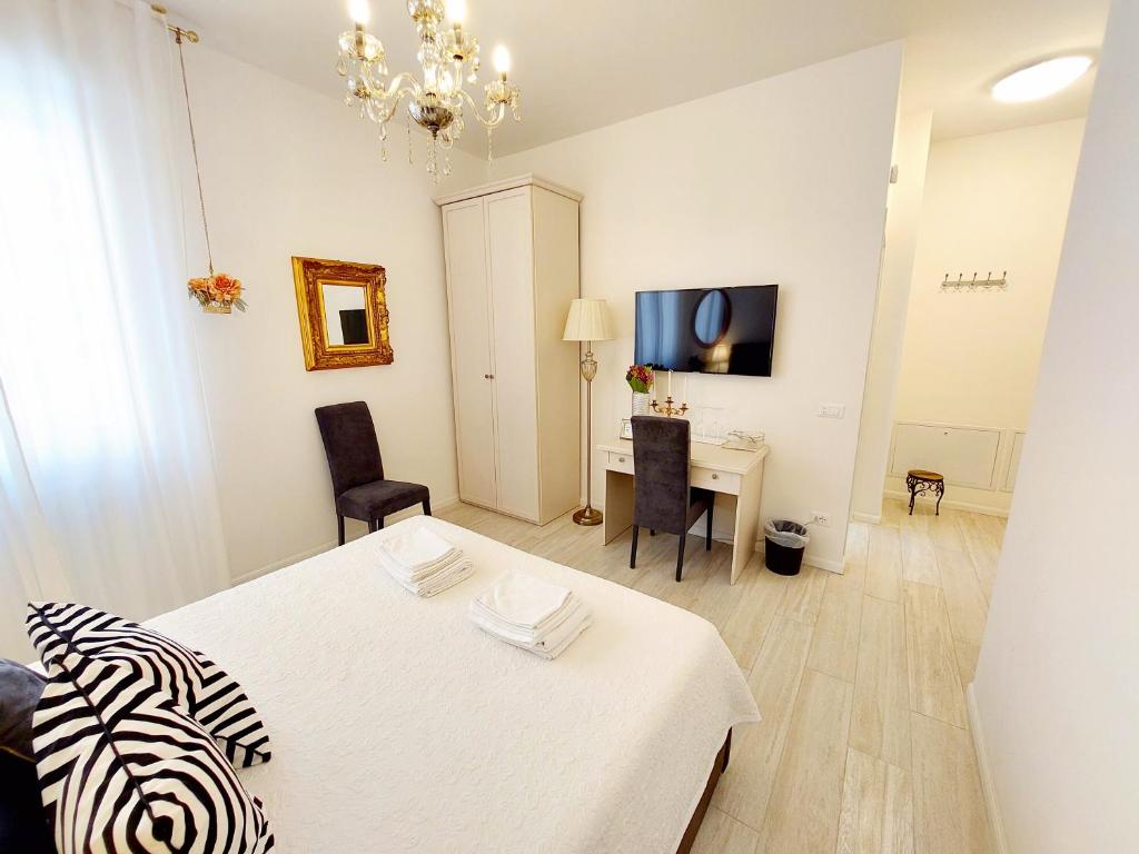 Postel nebo postele na pokoji v ubytování Piccolo Mondo Verona