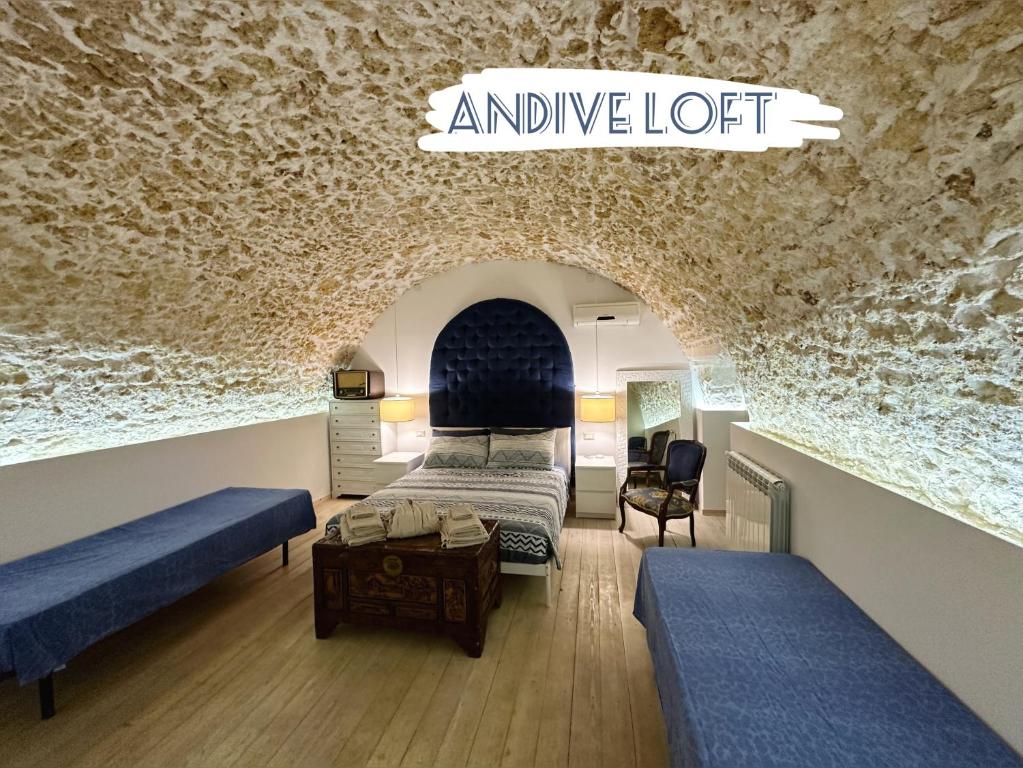 a bedroom with two beds and an unique loft at Andive in Syracuse