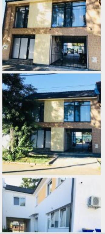two pictures of a building with windows on it at Mira apartman Queen lakosztály in Debrecen