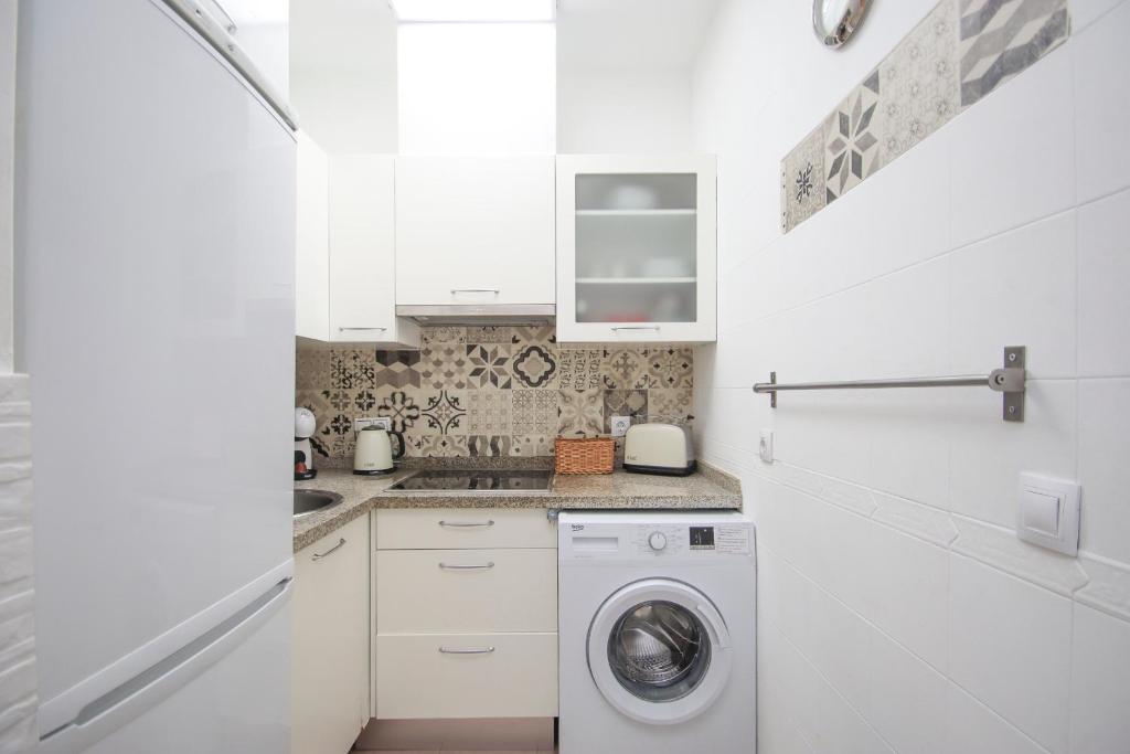 Kuchyň nebo kuchyňský kout v ubytování Lovely apartment in the old town of Seville
