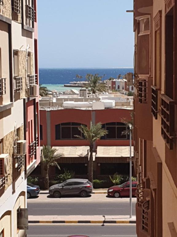 a view of a street from between buildings at Sun, Sea & Comfort in Hurghada