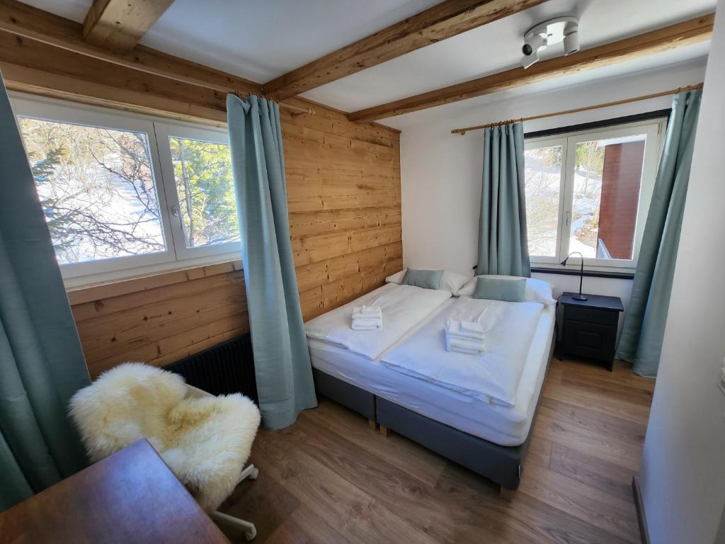 Postel nebo postele na pokoji v ubytování Hotel Bergsonne Rigi