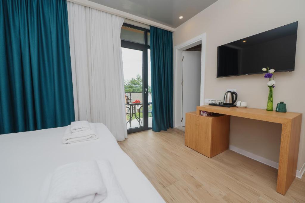 Voodi või voodid majutusasutuse Ritsa Resort toas