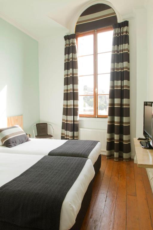 Postel nebo postele na pokoji v ubytování Hotel Ultramar
