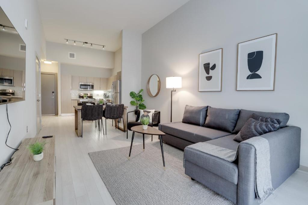 a living room with a couch and a table at Fantastic Condo 1BR at Crystal Flats in Arlington