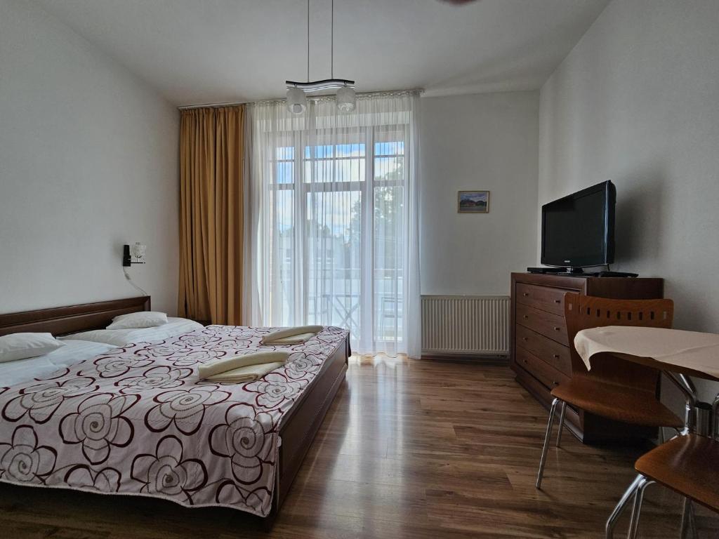 Postel nebo postele na pokoji v ubytování Penzion pod Krivanom