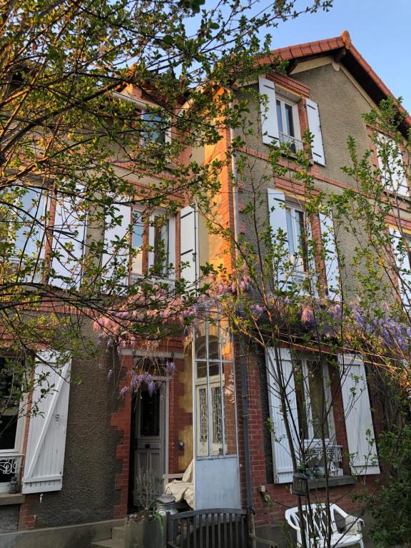 a brick house with white doors and windows at Ker Anna in Athis-Mons