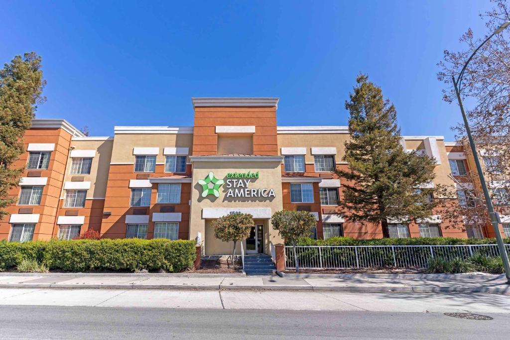 an apartment building with a sign that reads stay amazing at Extended Stay America Suites - San Jose - Downtown in San Jose