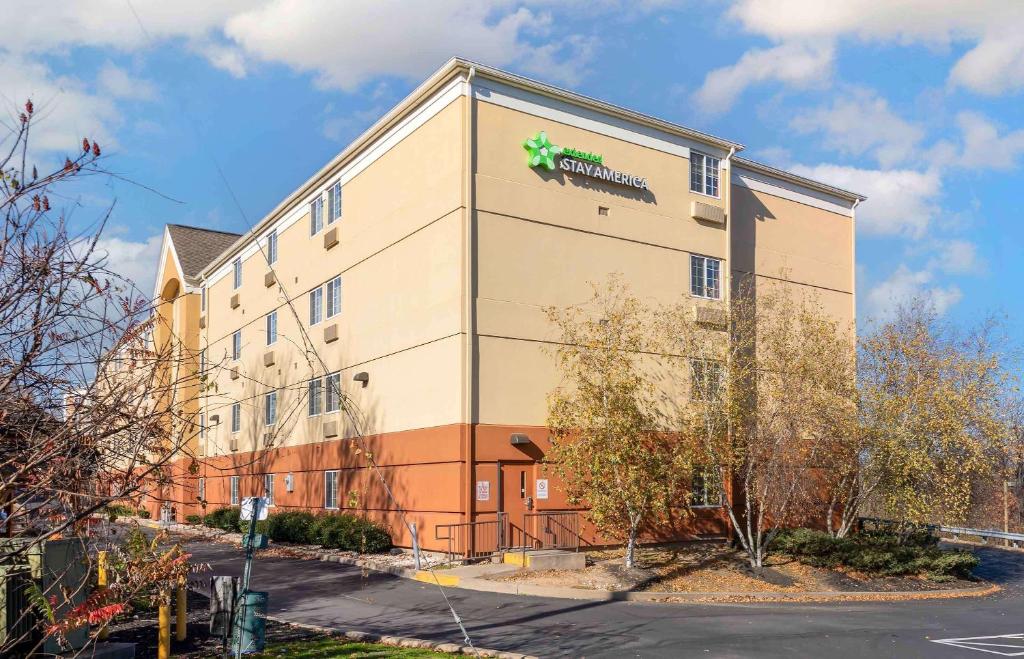 a large building with a sign on the side of it at Extended Stay America Select Suites - Wilkes - Barre - Scranton in Wilkes-Barre