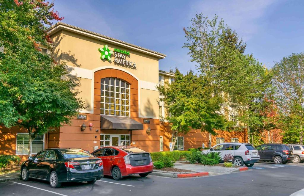 a building with cars parked in a parking lot at Extended Stay America Suites - Seattle - Bothell - Canyon Park in Bothell