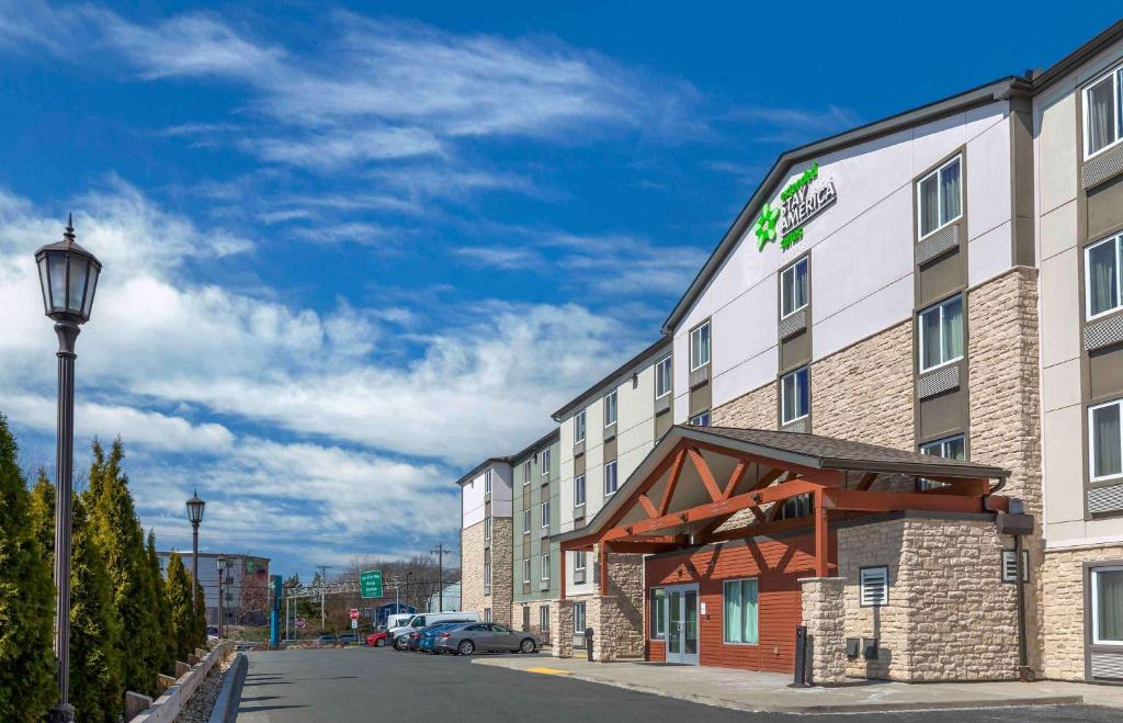 a hotel with a light pole next to a street at Extended Stay America Suites - Boston - Saugus in Saugus