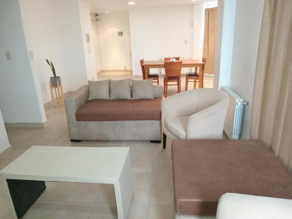 a living room with a couch and a table at Rukan in Comodoro Rivadavia