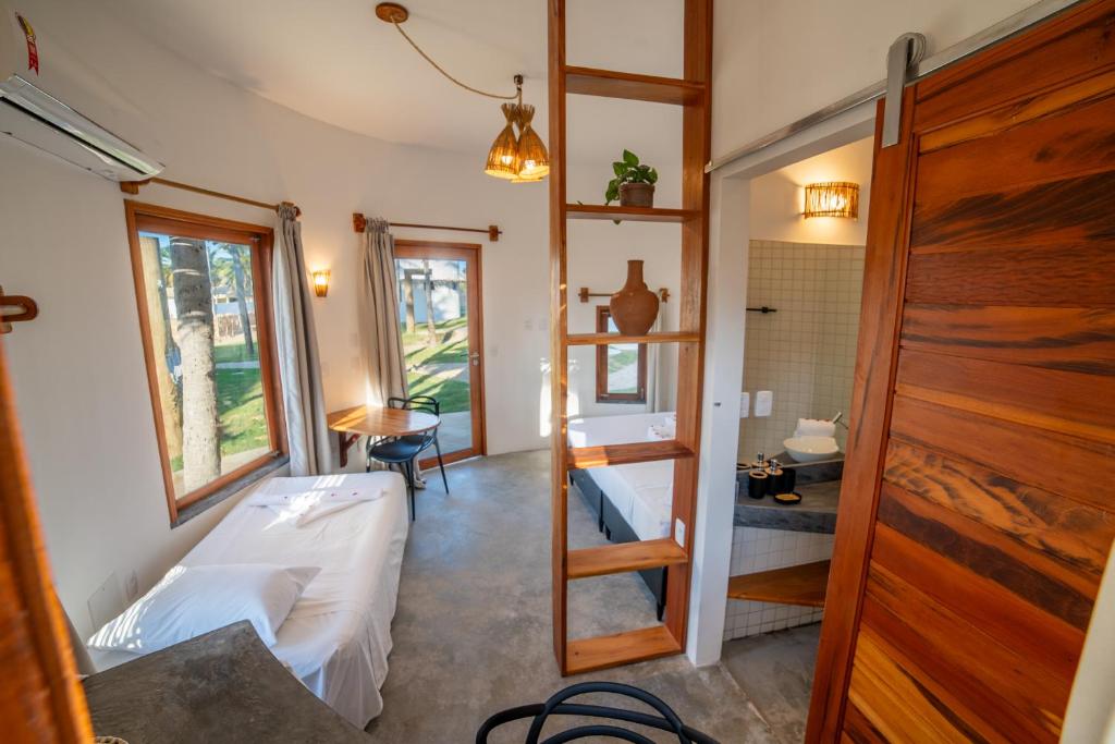 Postel nebo postele na pokoji v ubytování VentoVinte Beach Club
