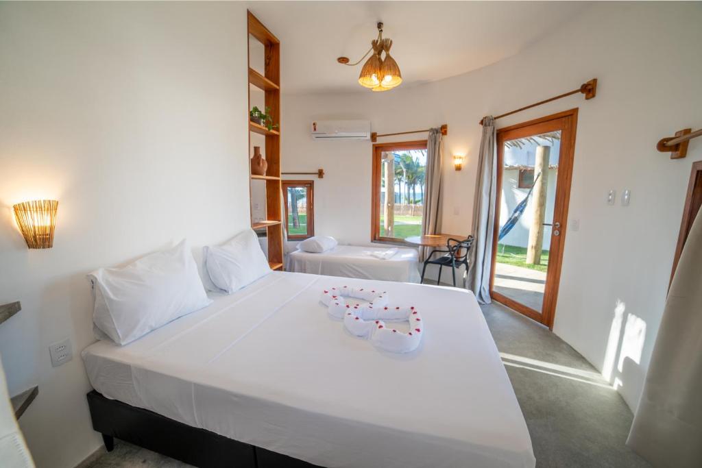 Postel nebo postele na pokoji v ubytování VentoVinte Beach Club